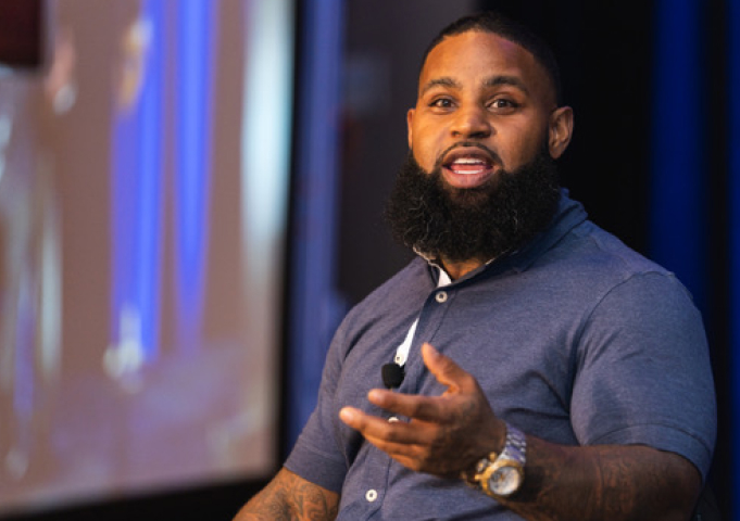 photo of a speaker speaking on stage